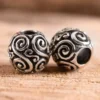 Runde Bartperle und Lockenperle mit Doppelspiralen aus Silber