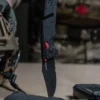 Taschenmesser Trident AT, schwarz, rot, Teilwellenschliff, SOG